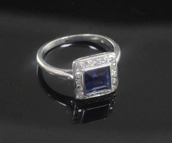 A 1920s/1930s platinum, synthetic? sapphire and diamond cluster ring, size E.